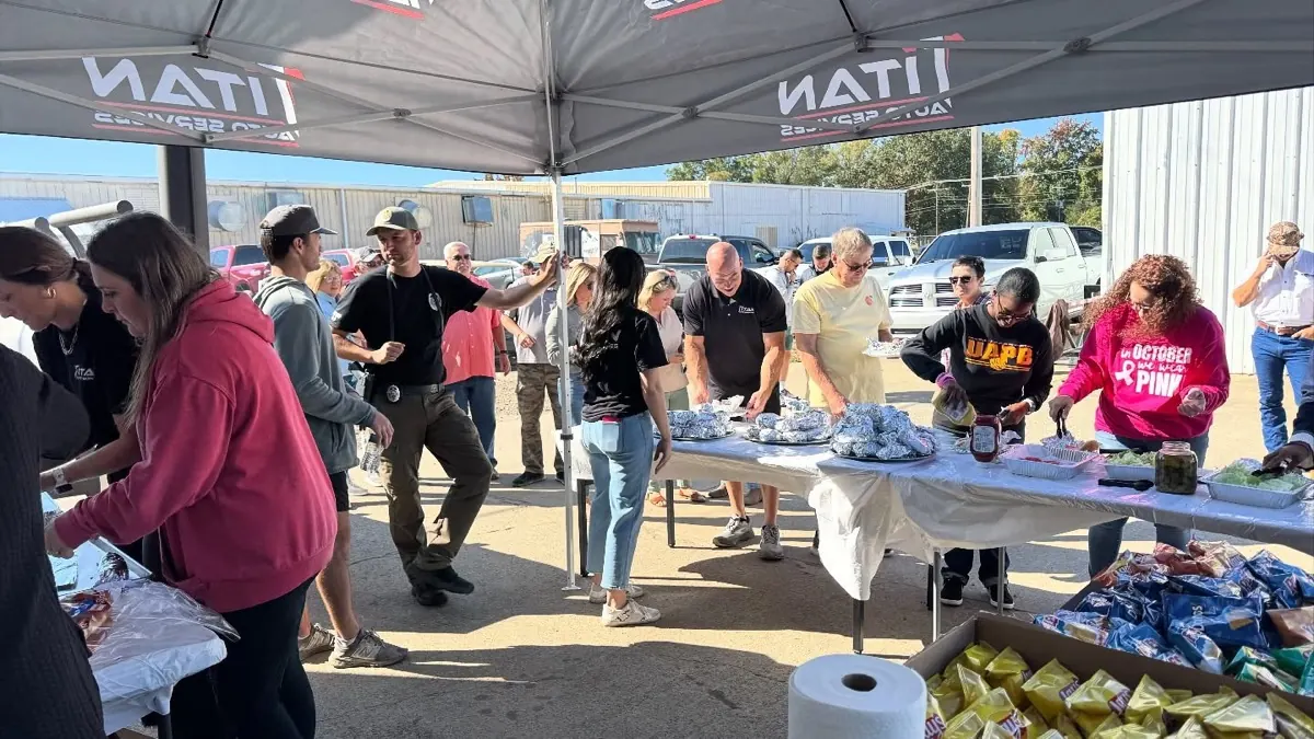 Volunteer crew running a Hurricane Bay HB-4 at a church fish fry