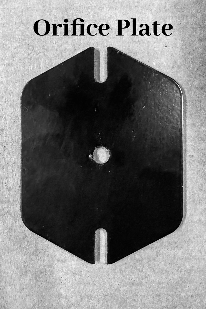 Brass orifice threaded into the orifice plate